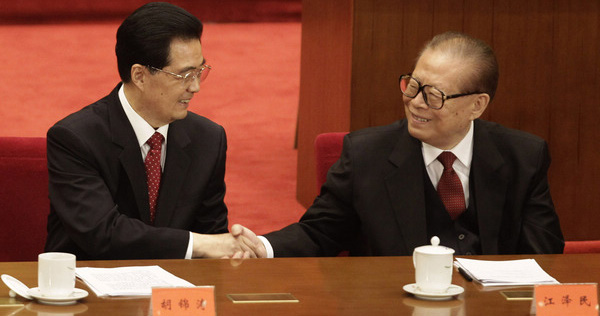 Former president Hu Jintao greets former leader Jiang Zemin during a ceremony at the Great Hall of the People in Beijing on Sunday, October 9, 2011, to mark the centennial of the 1911 Revolution. (China Daily, 2011)