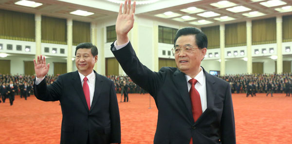 Hu Jintao and Xi Jinping wave to delegates to the 18th National Congress of the Communist Party of China on November 16, 2012.