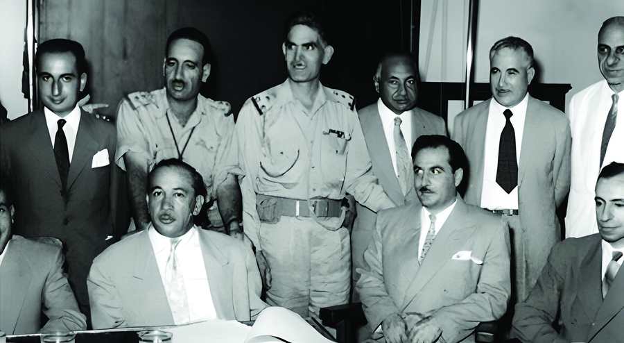 The intellectual father of Ba'athism ideology and the Ba'ath Political Movement, sociologist Michel Aflaq (first from the right in the front row), alongside the members of the July 14, 1958 Revolution in Iraq (TRT, 2020).