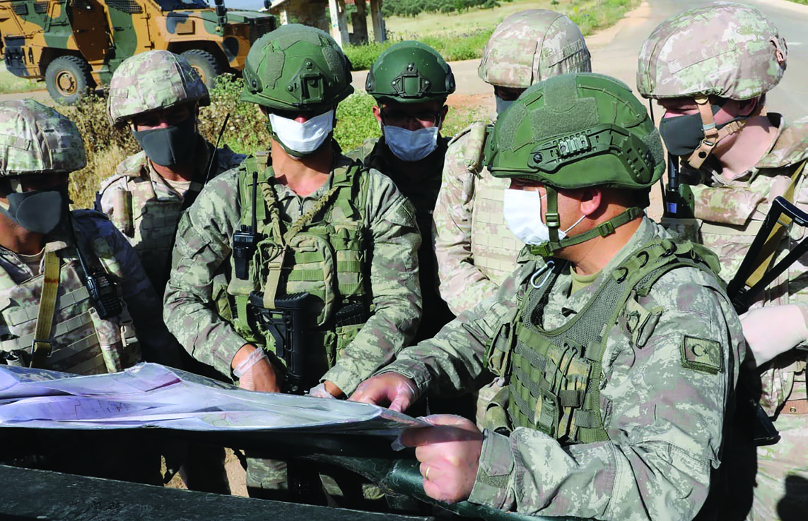 Soldiers take part in the joint patrol of Turkish and Russian troops in Idlib. (Mustafa Kaya/ Xinhua)